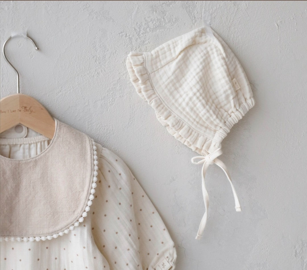 Cream ruffled bonnet