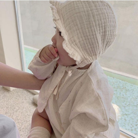 Cream ruffled bonnet