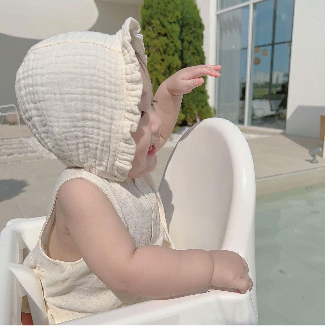 Cream ruffled bonnet